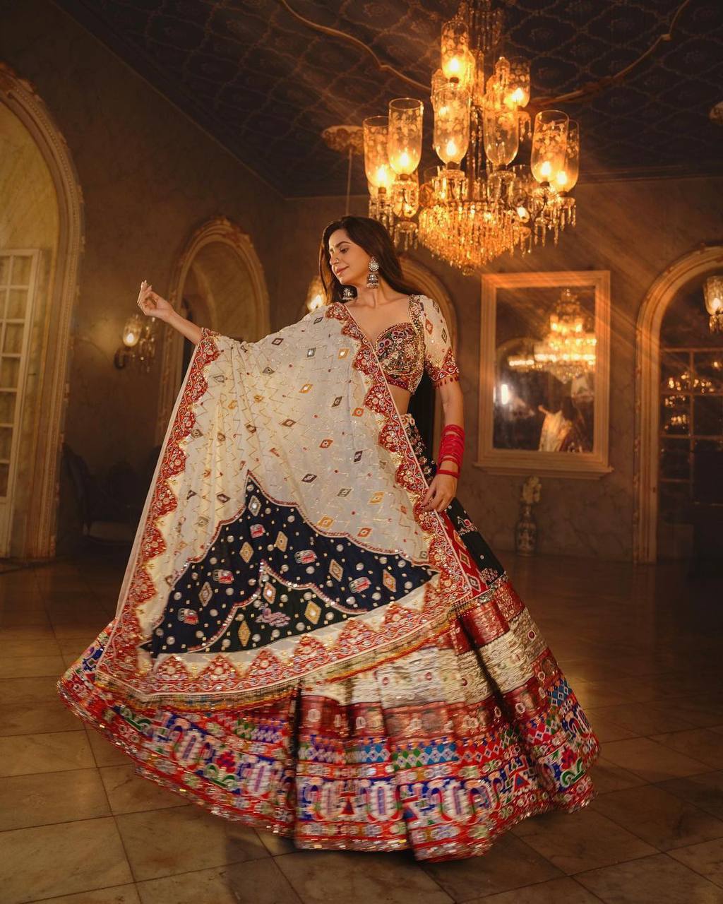 Traditional Kinjal Dave Special Print And MIrror Work Muslin Lehenga Choli